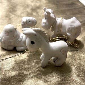 Precious Moments trio of porcelain bisque ornaments.